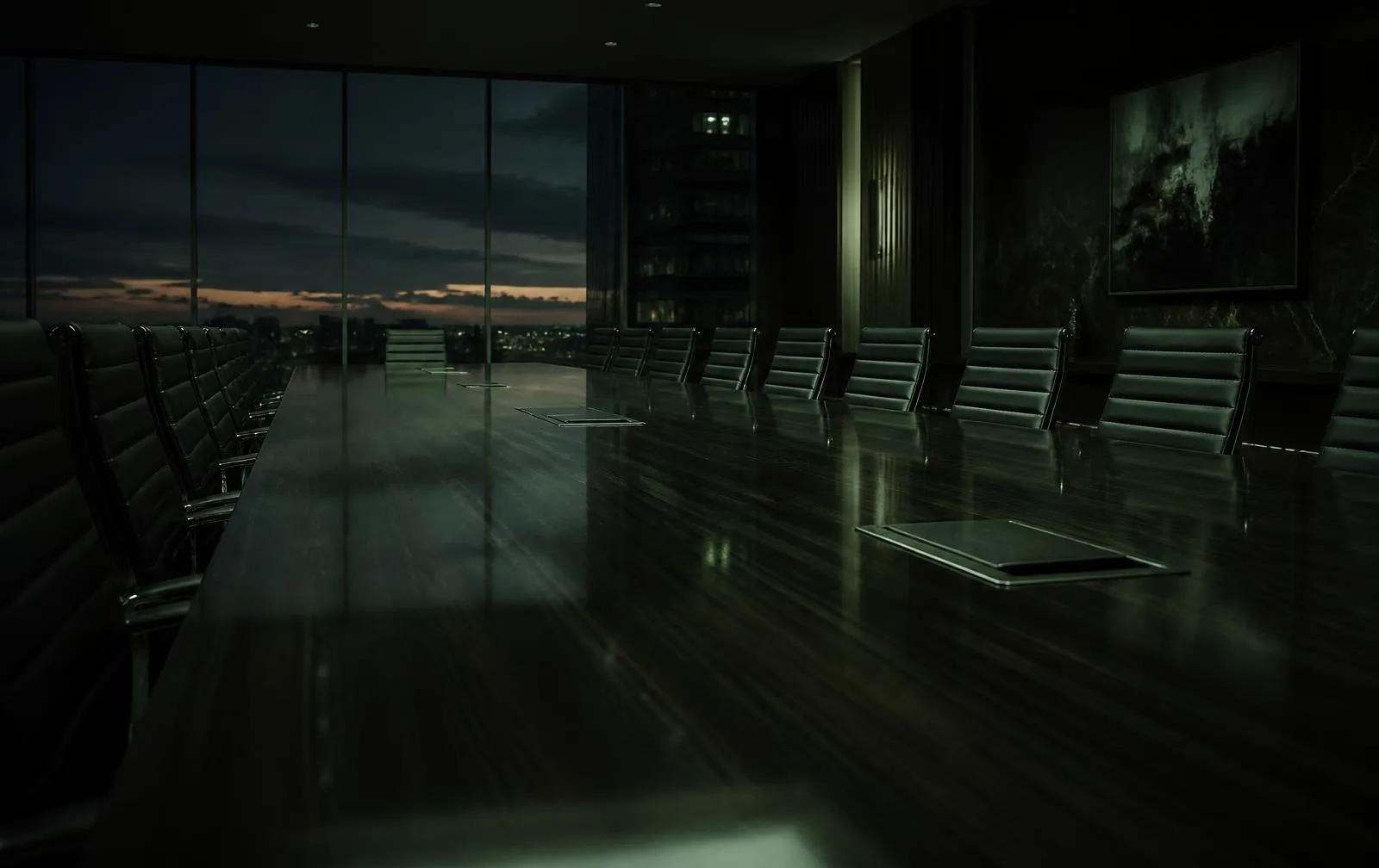 An empty boardroom table at dusk